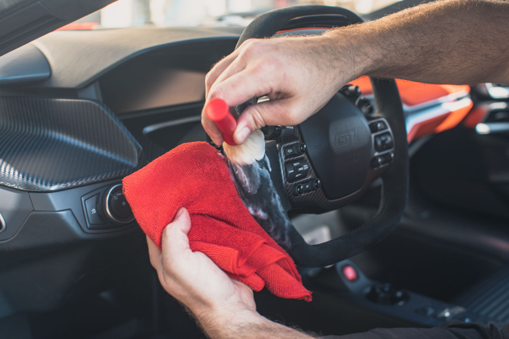 https://www.lenosgarage.com/cdn/shop/articles/Ford-GT-Alcantara-Steering-Wheel-Scrubbing_1680x.jpg?v=1579362514